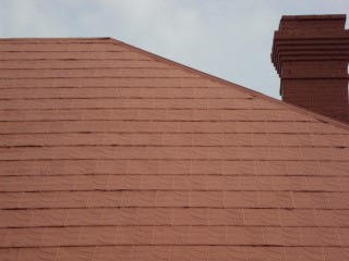 Coated shingles with terracotta acrylic