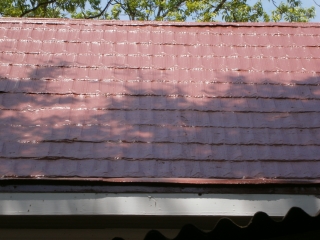 Enlarged view of 2014 chimney repaired area by Roof Menders, Inc