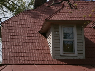New shingle coated with acrylic by Roof Menders, Inc