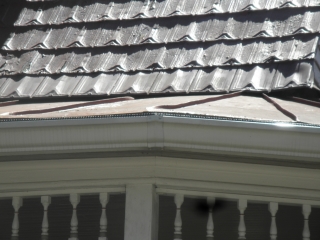 New shingle row under old tin row 