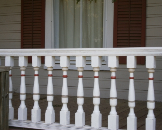 Close up of porch detail using traditional red in three areas