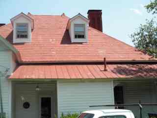 Driveway's main entrance showing rural roof addition in 1900s