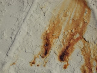 Closeup of a place where rust broke through within a year or so