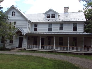 Final view of roofing work on rusty shingles