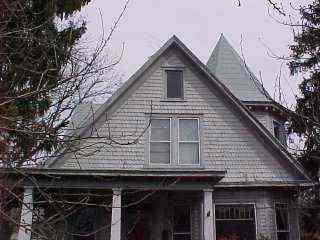 Manassas grey shingle roof with witch hat