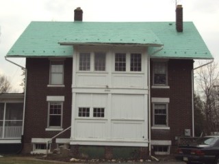 Herndon patina back side of home