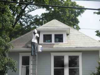 The two toned look of a house receiving its single coating